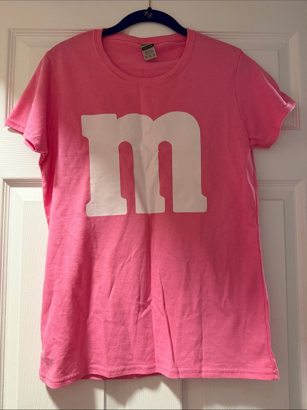 Gently worn Gildan Pink Short Sleeve Tee with Large White "m" Graphic